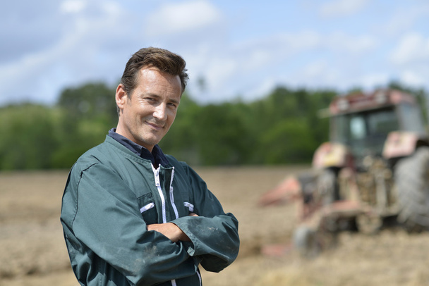 Farmer at cultivated land - Photo, Image