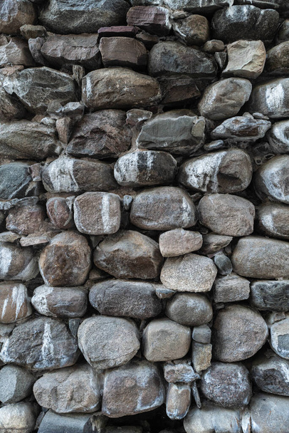 Textuur van een stenen muur. Oude kasteel stenen muur textuur achtergrond. Stenen muur als achtergrond of textuur. Delen van een stenen muur, voor achtergrond of textuur. - Foto, afbeelding