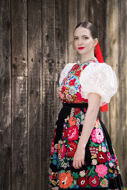 Beautiful Woman In Traditional Slovak Folklore Costume. - 写真・画像