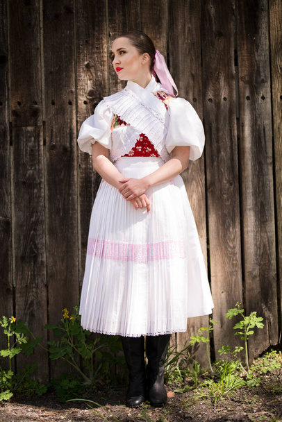 Beautiful Woman In Traditional Slovak Folklore Costume. - 写真・画像