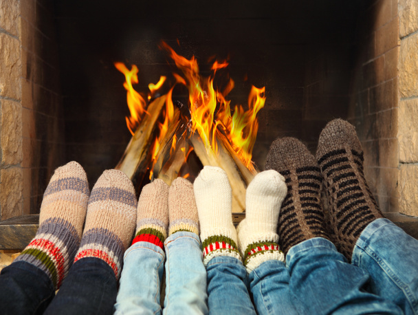 Feet warming near the fireplace - Photo, Image