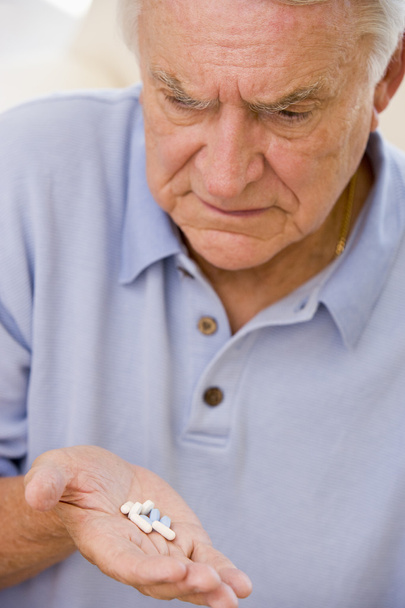 Senior Man Looking At Medicine - Foto, immagini
