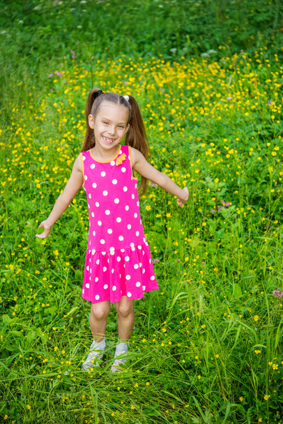 little girl in green summer city park - Photo, Image