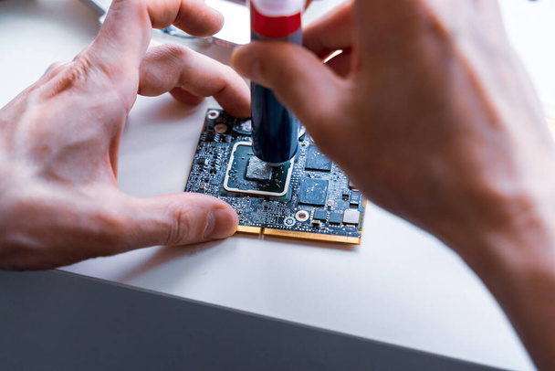 Electronic hardware repair. Computer macro technician engineer service. Technology maintenance pc from man - Photo, Image