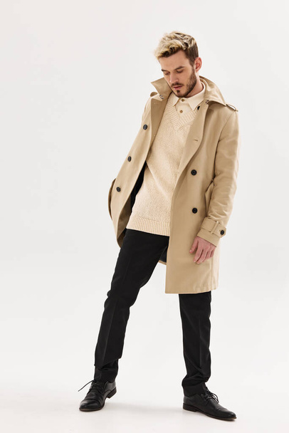 man autumn coat fashion modern style posing - Foto, imagen