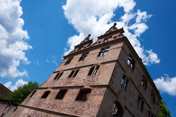 A low angle shot of an old brick buildings under a bright sky - Zdjęcie, obraz