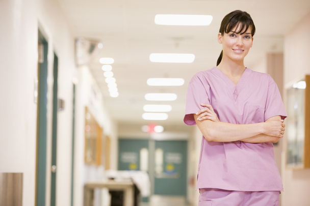 Nurse Standing In A Hospital Corridor - Foto, imagen