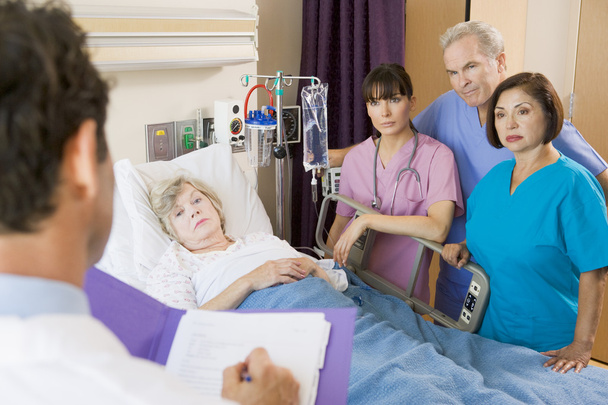 Doctor Making Notes On Patient - Photo, Image