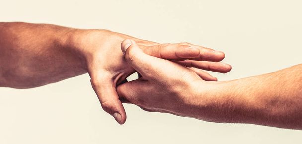 Close up help hand. Helping hand concept, support. Helping hand outstretched, isolated arm, salvation. Two hands, helping arm of a friend, teamwork - Foto, Imagem
