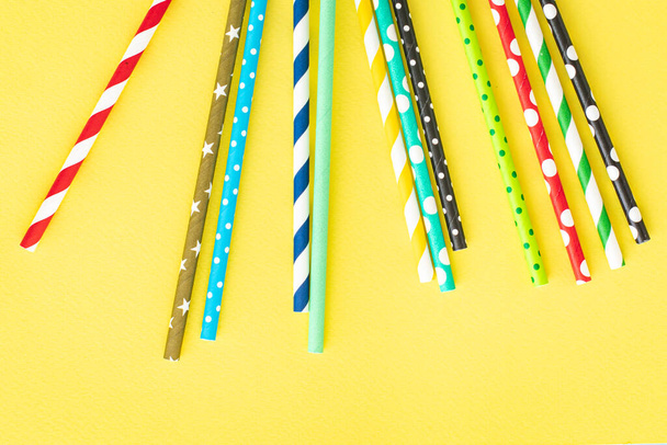 paper straws multicolored striped dotted straws scattered Flat lay useful ecology cocktail or juice, lemonade to usebiodegradable on the table concept party healthy meal copy space food background - Photo, Image
