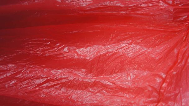 Plastic bags red color. International plastic bag free day. Say no to plastic. Go green. Save nature. Save ocean. World ocean day. Company against plastic bags. - Photo, Image