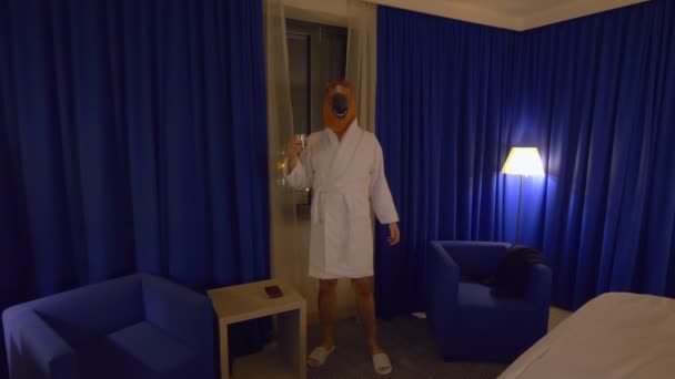 Man in a horse mask relaxing and drinking whisky after work in 4k slow motion 60fps - Footage, Video