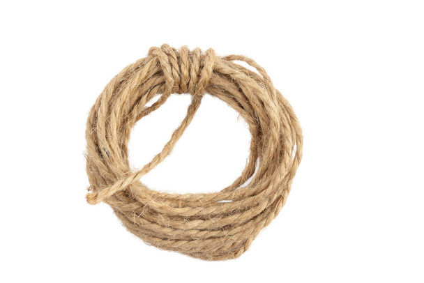 packing rope made of jute with a tied bow, isolate for clipping on a white background - Photo, Image