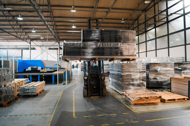 Forklift loader in storage warehouse shipyard. Distribution products. Delivery. Logistics. Transportation. Business background. High quality photo - Fotografie, Obrázek