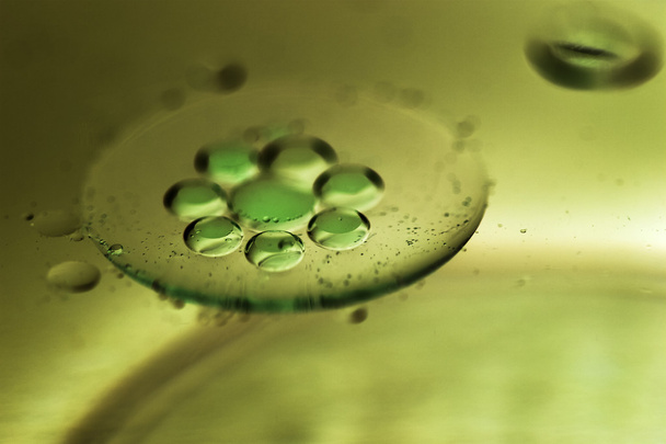 Composition of oil drops on a water surface - Photo, image