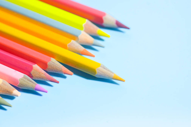 colorful pencils on blue background, copy space - Photo, Image