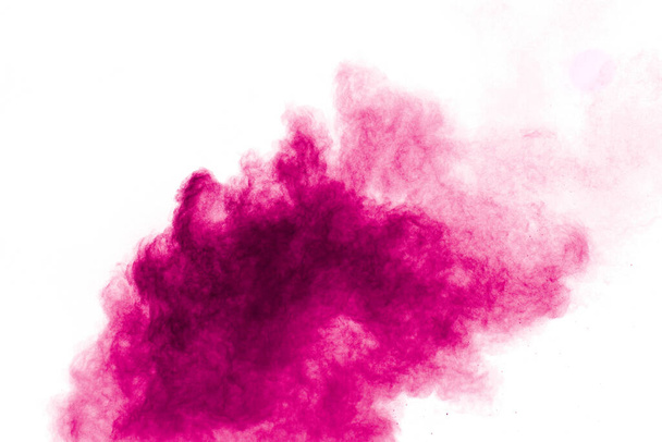 Έκρηξη ροζ χρωματισμένης σκόνης που απομονώνεται σε λευκό φόντο.Ροζ πιτσιλιές σκόνης. - Φωτογραφία, εικόνα