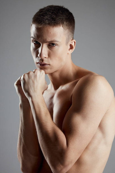 boxer with fist on gray background closeup portrait  - Fotografie, Obrázek