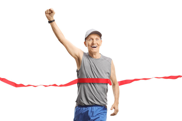 Elderly man on the finish of a marathon gesturing happiness with hand isolated on white background - Photo, image