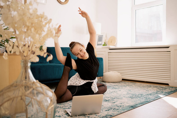 Pretty young lady practicing ballet online - Photo, Image