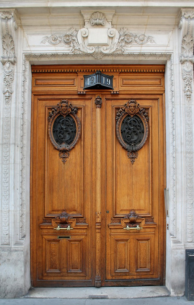 Ornate carved wooden door in Paris, France - 写真・画像
