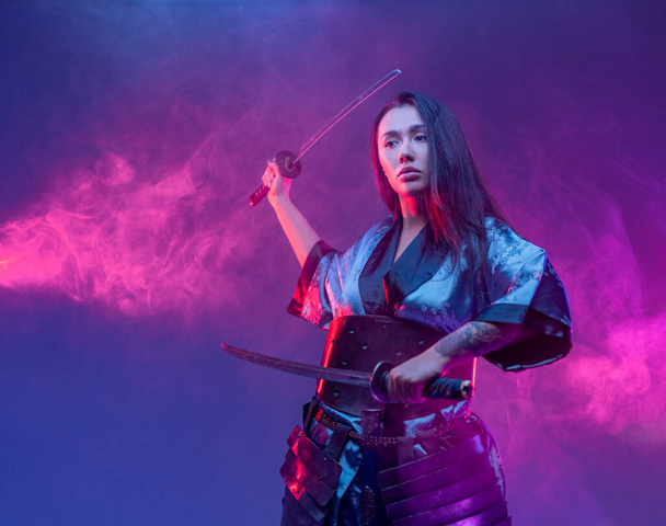 Cyberpunk style woman fighter with samurai swords - Photo, Image