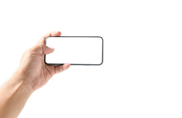 Man hand met smartphone met leeg scherm, geïsoleerd op witte achtergrond - Foto, afbeelding