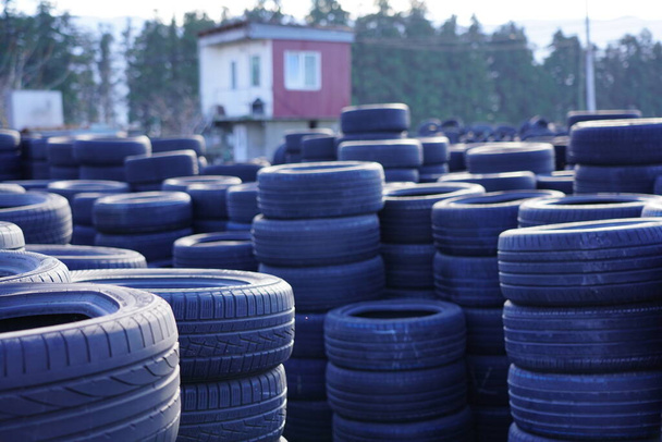 A pyramid of tyres. car service seasonal change of tyres on the automobile - Photo, Image