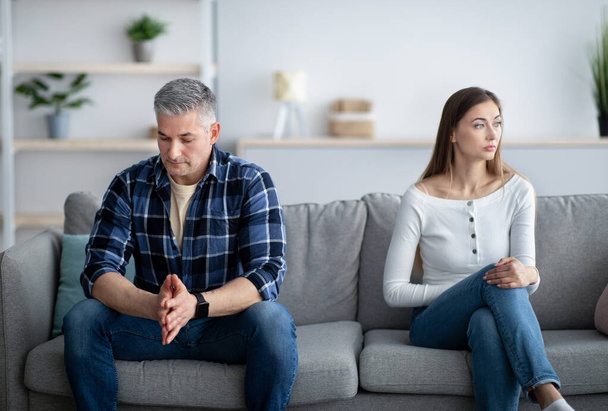 Depressed mature man and woman having relationship problems, going through marital crisis at home - Photo, Image