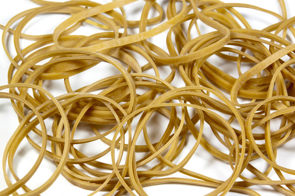 Closeup of Rubber Bands Stacked in a Pile - Photo, Image