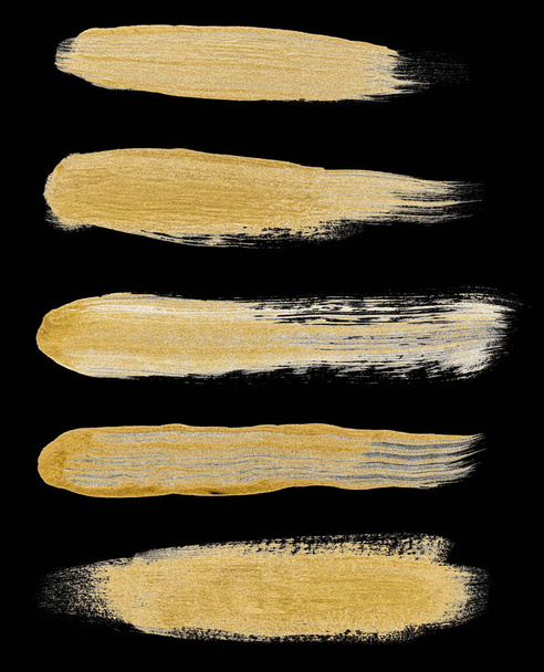 Collection of various hand drawing golden paint brush strokes isolated on black background - Photo, Image