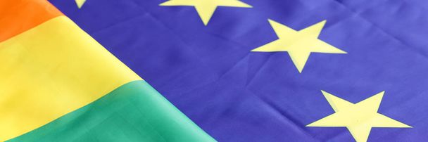 Lgbt ve eu bayrağı yan yana uzanan yakın plan arkaplanı - Fotoğraf, Görsel