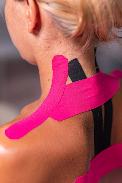 kinesio taping on the body, neck back in the salon - Fotoğraf, Görsel