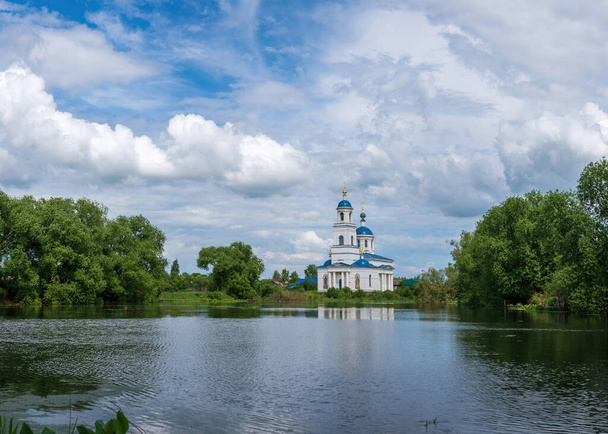 Temple on the shore of the pond, Church of the Intercession of the Most Holy Theotokos, Russia. - Φωτογραφία, εικόνα