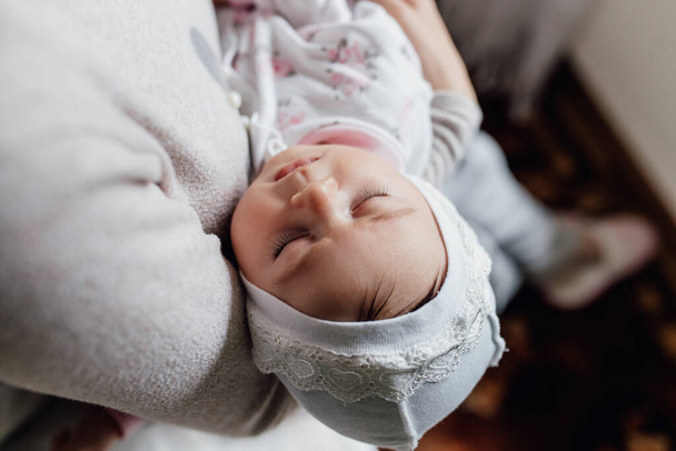close up of newborn baby in a tender embrace. - Fotoğraf, Görsel