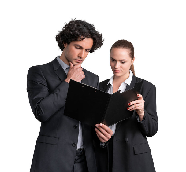 Businesswoman and businessman in formal suit is holding and pensive looking into a clipboard with papers or contract. Business people Isolated over white background. Concept of teamwork - 写真・画像