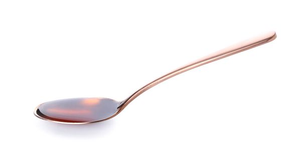 Spoon with tasty honey on white background - Photo, Image