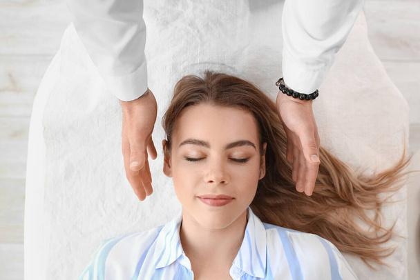 Reiki master working with patient - Photo, image