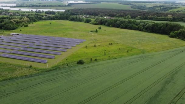 Aerial view of Solar Panels Farm solar cell with sunlight. Drone flight over solar panels field, renewable green alternative energy concept. - Footage, Video