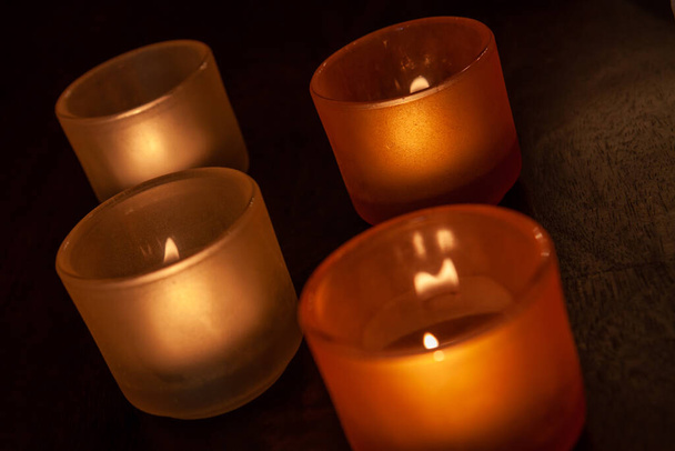 A closeup shot of burning scented candles - Fotó, kép