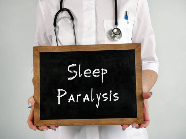 Концепція охорони здоров'я означає Сплячий параліч з написом на аркуші паперу
 - Фото, зображення