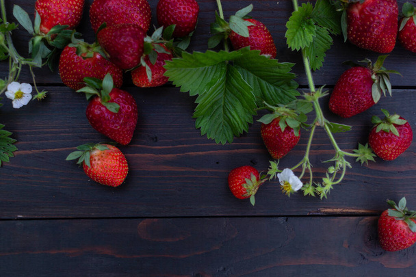 Strawberries in a box on a dark background - Foto, immagini