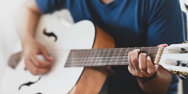 cropped shot of man playing acoustic guitar  - Photo, Image