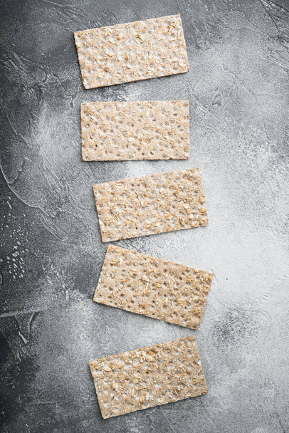 Crunchy crispbread Healthy snack set, on gray stone table background, top view flat lay, with copy space for text - Foto, immagini