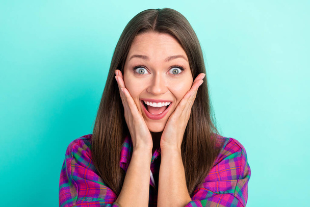 Portrait of attractive cheerful amazed girl great news reaction isolated over bright teal green color background - Foto, Imagem