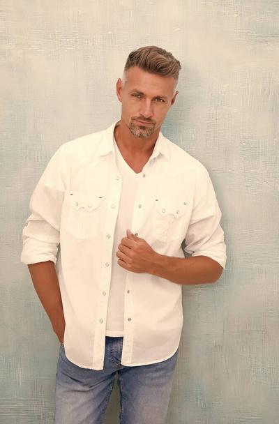 Handsome man perfect white shirt denim pants, barbershop hairdresser concept - Fotó, kép
