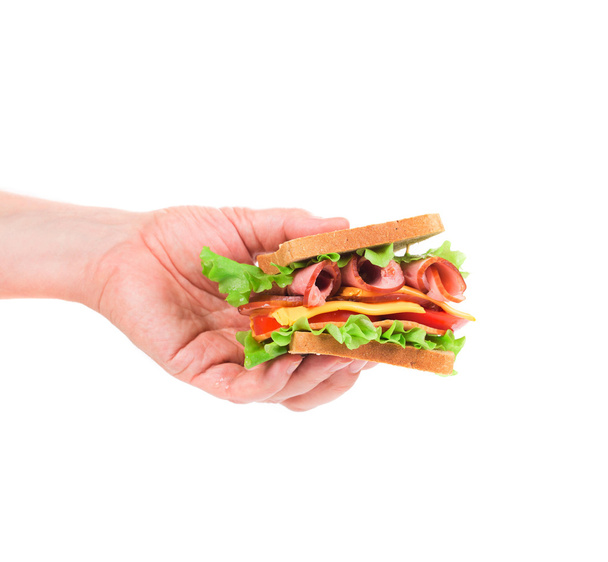 Hand holds french toast sandwich. - Zdjęcie, obraz