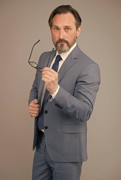 Fashion portrait of man. bearded man after hairdresser. portrait of mature man wearing glasses. adult financial director in suit. best business trainer. skilled bank worker. professional in business - 写真・画像