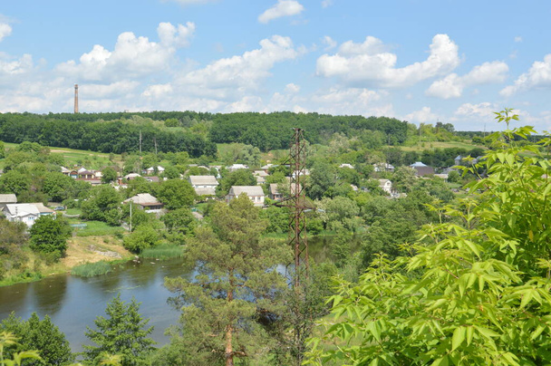 Small town panorama with a river and houses - Foto, Imagen