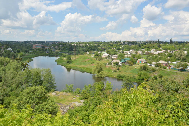 Small town panorama with a river and houses - Foto, Imagen